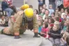 (GREG JOHNSON/Frontiersman) Central Mat-Su Fire Department
firefighter Nick Durban crawls along the stage at Machetanz
Elementary School Thursday as part of a fire safety
demonstration.