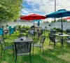 Outdoor dining spaces, like the backyard at The Grape Tap restaurant in Wasilla, have been in high demand so far this summer. With so much great early season weather, decks and patios around 