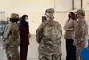 H.E. Roya Rahmani, second from left, Embassy of Afghanistan ambassador to the United States, speaks with Airmen assigned to the 23d Wing before a graduation ceremony Nov. 13, 2020, at Moody A
