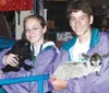 Megan Kenley and Jed Fry are working at the Alaska State Fair,
earning money by taking care of the animals. Photo by CASEY
RESSLER/Frontiersman.