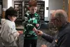 Braiden Wheeler and Wyatt Wheeler trade and collect pins with George Smith after Smith spoke about the unofficial sport of pin trading, which goes back to the start of the Arctic Winter Games