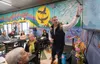 Dave Balmer, chairman of the Carson-Cottle Center building committee, explains the details going into the Carson-Cottle Center to attendees at the MY House open house. J. David McChesney/Fron