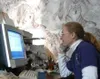 Lynda Plettner schedules a dog sled tour while on the phone with
a client. She charges $100 per person to take them around the Big
Lake area in the winter. She is currently working on a custo