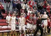 Wasilla head coach Ryan Engebretsen and the Warriors cheer a late basket during a 43-42 win over Colony Saturday at Wasilla High. Courtesy of Bruce Eggleston/matsusports.net