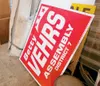 ROBERT DeBERRY/Frontiersman An old political sign rests against
the wall in a barn converted to a garden check-out facility and
small store at Bella Farm and garden. Owner betty Vehrs recycle