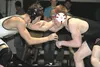 Colony's Kamber Lucas battles with Wasilla's Nate McKimson during the 152-pound final of the Northern Lights Conference Championships wrestling tournament. McKimson won the match to repeat as