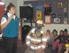 First-graders learn about smoke alarms from Kym Savage. The
children also learned that firefighters in uniform, though they may
look scary, are there to help. Photo courtesy of Kathleen Krug.