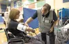 Celena Randolph plays the part of a disaster shelter patient as
Mat-Su Regional Medical Center’s Charles Darnell checks her vital
signs during Saturday’s mock disaster as part of Operation Al