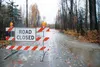 Floodwater pours across Burrow Street during floods in October 2015 near Willow. BRIAN O'CONNOR/Frontiersman