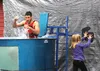 Wyatt Mulhaney, a member of the Houston High School varsity football squad, falls into the dunk tank during the Houston Founder's Day celebration Saturday, Aug. 20, 2016, in Houston. After fa