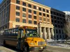 A school bus drives in front of the Alaska State Capitol on Monday, Feb. 3, 2025. James Brooks/Alaska Beacon