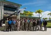 Participants of the Integrated Air and Missile Defense Center summit pose in front of the Hawaii Air National Guard Headquarters building, Joint Base Pearl Harbor-Hickam, Hawaii, Sept. 10, 20