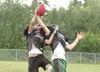 ROBERT DeBERRY/Frontiersman Two members of the Colony Knights
varsity football squad make a leap for a ball in a drill during the
team’s practice Thursday afternoon. The Knights withstood a h