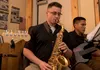 U.S. Army Spc. Joseph May, 9th Army Band saxophonist, performs a solo at the Eagle River VFW, Alaska, Nov. 9, 2019. The purpose of the event was to honor those who served in the military. Sol