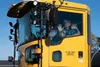 JBER residents wave to onlookers while getting the opportunity to ride as passengers during the Snow Parade hosted by the 773d Civil Engineer Squadron at Joint Base Elmendorf-Richardson, Alas