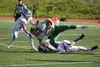 Palmer senior Larry Cutsforth works to bring down Service's Xavier Harris with the help of a teammate during a 27-6 loss to the Cougars in Anchorage Aug. 19. The Moose make the short trip to 