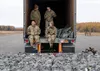 U.S. Army paratroopers assigned to the 4th Infantry Brigade Combat Team (Airborne), 25th Infantry Division, U.S. Army Alaska, manage parachutes after a series of jumps from a CH-47 Chinook op