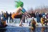 Isaiah Tira takes the plunge into Wasilla Lake Saturday
afternoon at the 2012 Mat-Su Polar Plunge. More than 100 jumpers
turned out to raise money for Valley charities. ROBERT DeBERRY/Frontie