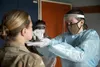 Spc. Elizabeth Porter, a field medic with the 1-131st Aviation Regiment, swabs a soldier’s nose for a COVID-19 test during Defender Europe 21, May 16, 2021.