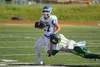 Palmer senior running back Larry Cutsforth breaks a tackle during a loss to Service early in the season. Cutsforth and the Moose host Thunder Mountain in the Division II semifinals Saturday a