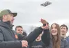 Hands-on experience with drone operations is a key step toward future success. Here, Thomas Tapp of AKDRONE works with Wasilla High School junior Bailey Priebe as a small drone lands in her h