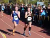 Palmer freshman Katey Houser and Waslla senior Allison Van Pelt sprint the final stretch of the Division I girls' race during the ASAA/First National Bank State Cross-Country Running Champion