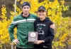 Colony cross-country co-head coaches Norm Rousey and Rhonda Knopp pose with the Region III Coach of the Year award during teh 2016 season. Courtesy of Katie Rousey