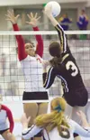 ROBERT DeBERRY/Frontiersman Wasilla junior Sariah Tuisaula
reaches to block a South spike during the ASAA/First National Bank
State Volleyball Championships at the Curtis D. Menard Memorial
S