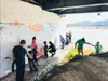 About a dozen  people helped paint over vulgar graffiti and clean up the area around the Matanuska River bridge recently. Courtesy photo