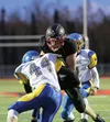 Houston senior Noah Griffeth is met near the line of scrimmage by Monroe Catholic's Grant Olson during a 41-0 win over Rams Sept. 18 at Houston High School. Houston improved to 3-3 with the w