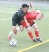 JEREMIAH BARTZ/Frontiersman West senior Suwat Dyphibone grabs
and falls on to Wasilla’s Dustin Hout during the first half of the
Eagles’ 1-0 win over the Warriors Friday at Anchorage Football