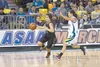Colony junior Sarah Brumbaugh is chased down the court by Kodiak senior Jerica Nelson during the 4A state title game Saturday at the Sullivan Arena in Anchorage. Kodiak beat Colony to win its