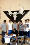 Surrounded by his fellow football captains, Palmer senior Mike
Weber signed a national letter of intent to join the Valley City
State football squad next season. Photo by JEREMIAH BARTZ/
Fron
