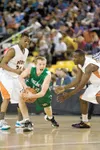 ROBERT DeBERRY/Frontiersman Colony Knight John Palmer protects
the ball from two West High Eagles during the semifinal game
Tuesday at the 4A state basketball tournament in Anchorage.