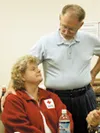 Sally Anderson basks in kind words from longtime Red Cross
volunteer Gordon Taylor. Anderson, the former head of the local Red
Cross chapter, was among those honored at a recent Red Cross
bar