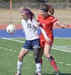Soldotna's Abi Tuttle (29) shields Wasilla's Hayley Brandon from the ball Saturday at Justin Maile Field in Soldotna. Joey Klecka/Peninsula Clarion