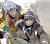 ROBERT DeBERRY/Frontiersman Tessa King gives last-minute tips to
Iditarider Darian Stengrim before the ceremonial start of the
Iditarod Trail Sled Dog Race in Anchorage Saturday morning.