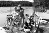 Dan McDowell and his son Skyler demonstrate the wheel-chair
accessible fishing boat that McDowell had custom built for his
fishing guide service on the Kenai River. Photo courtesy Dan
McDowel