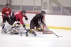 Members of the Houston hockey team run drills during practice Monday afternoon at the Curtis D. Menard Memorial Sports Center in Wasilla. ROBERT DeBERRY/Frontiersman.com