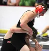 Colony's Sam Sisco tries to break the grasp of Wasilla's Isaiah Elvsaas during the semifinal round of the Lancer Smith Memorial in November of 2016. Both wrestlers are past state champions an