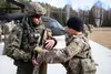 A Paratrooper assigned to the Troop B, 5-73 Cavalry 82nd Airborne Division trains a Polish soldier assigned to the 21st Rifle Brigade on his squad designated marksman rifle during a combined 