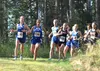 Palmer sophomore Katey Houser leads a pack of runners during the varsity girls race of the Redington Invitational. Tim Rockey/Frontiersman