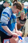 An off-duty Emergency Medical Technician shows her tourniquet skills while at the Mat-Su Regional tent at the Alaska State Fair on Tuesday, August 27. Katie Stark/For the Frontiersman
