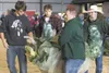 ROBERT DeBERRY/Frontiersman A giant cabbage is carried across
the arena after being weighed at the 2011 Alaska State Fair Giant
Cabbage Weigh-Off Friday evening. Robert DeBerry