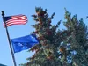 An American and Alaskan flag wave in the wind at Wasilla City Hall. Frontiersman file photo