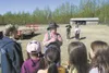 Margaret Heaven explains the hay ride rules to a group of
Machetanz Elementary students Monday at Heaven’s Hayfield. Local
school have been visiting the Heaven homestead off Fairview Loop
for