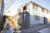 Fire damaged items fill a trash Dumpster outside the Earthly
Treasures Thrift Shop in Wasilla. Wasilla fire and police officials
have launched an arson investigation of two suspicious Decembe