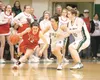 ROBERT DeBERRY/Frontiersman Wasilla junior Shelby Fulton, left,
keeps the ball away from Colony sophomores Maria Bowker, center,
and Alex Coon in the final minutes of the Warriors’ 43-39
come