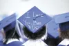The mortar board of one Palmer High School graduate has a
special note for mom and dad. (ROBERT DeBERRY/Frontiersman file
photo)