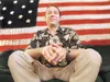 ROBERT DeBERRY/Frontiersman Alaska public defender John Richard
sits in his office in Palmer in front of his 140-year-old U.S.
Centennial flag.